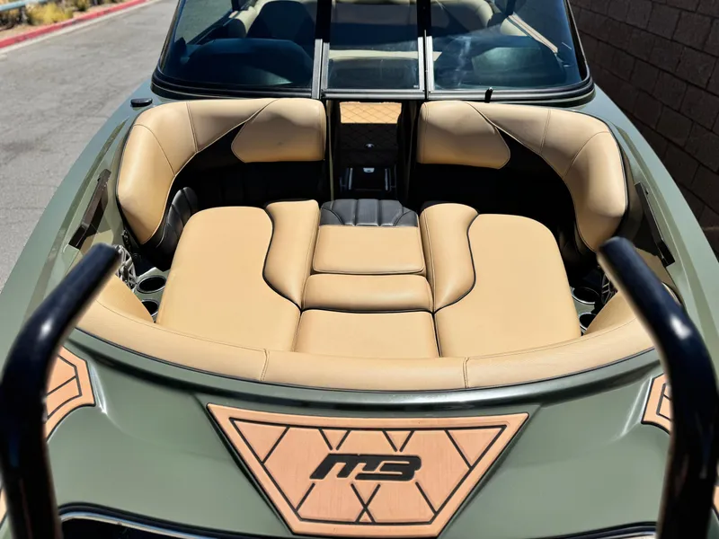 Slide: The Image of 2022 MB F21 Tomcat boat interior with tan leather seating and stylish design. - 14