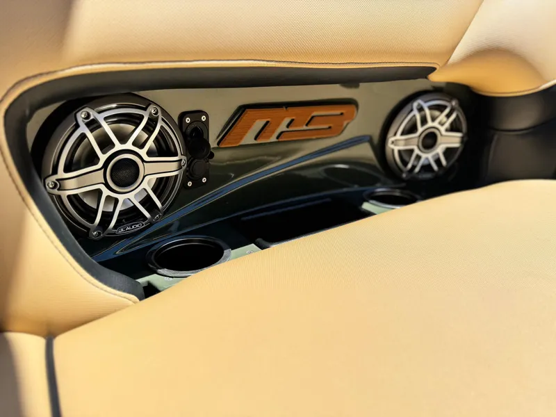 Slide: The Image of Interior of 2022 MB F21 Tomcat featuring JL Audio speakers and beige upholstery. - 22