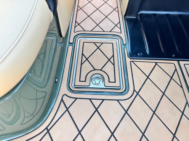 Slide: The Image of 2022 MB F21 Tomcat interior with diamond-patterned flooring and storage compartment. - 32