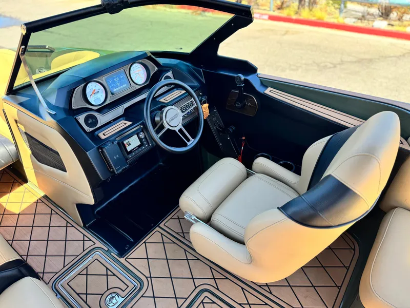 Slide: The Image of Interior of 2022 MB F21 Tomcat boat with modern dashboard and beige seating. - 34