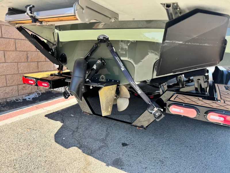 Slide: The Image of Rear view of 2022 MB F21 Tomcat boat with propeller and trailer details. - 7