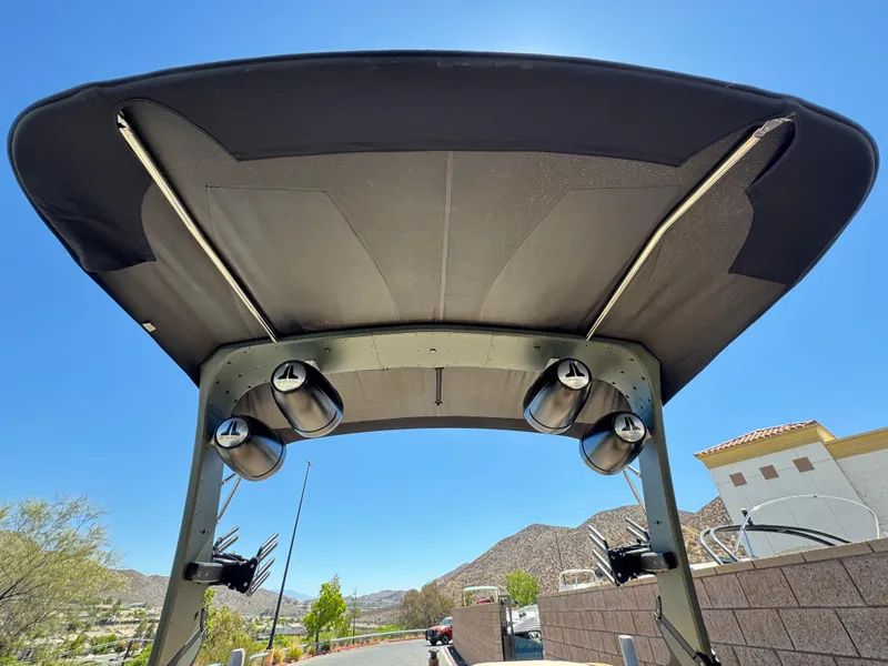 Slide: The Image of 2022 MB F21 Tomcat boat tower with speakers, under clear blue sky. - 9