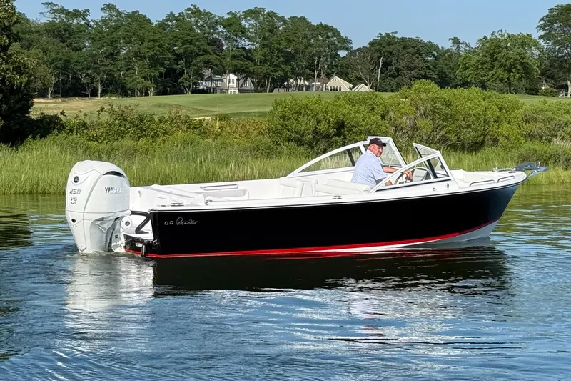 Slide: The Image of 2026 Rossiter 23 OPEN boat on calm water, featuring a Yamaha V6 engine. - 10