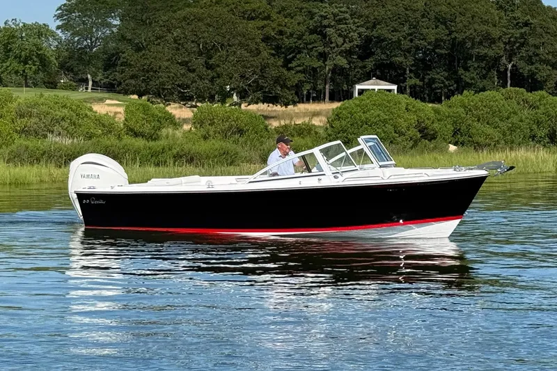 Slide: The Image of 2026 Rossiter 23 OPEN boat cruising on a calm lake with lush greenery. - 8