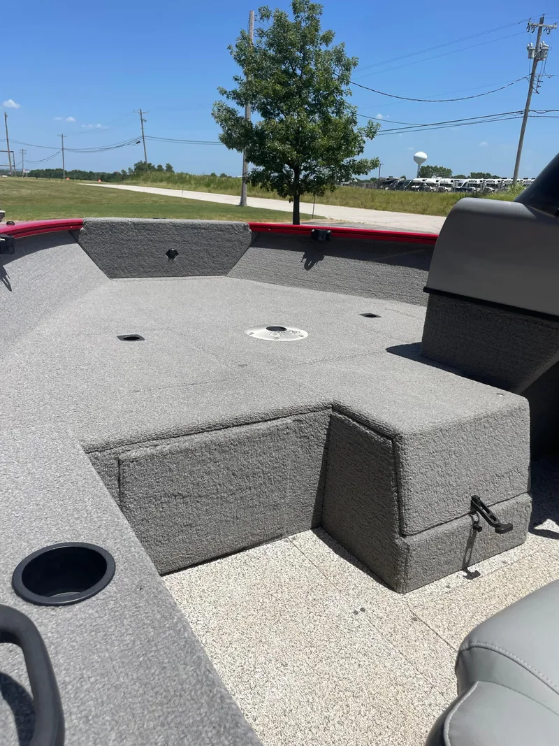 Slide: The Image of 2012 Tracker Pro Guide 175 boat interior with gray carpet and seating area. - 10