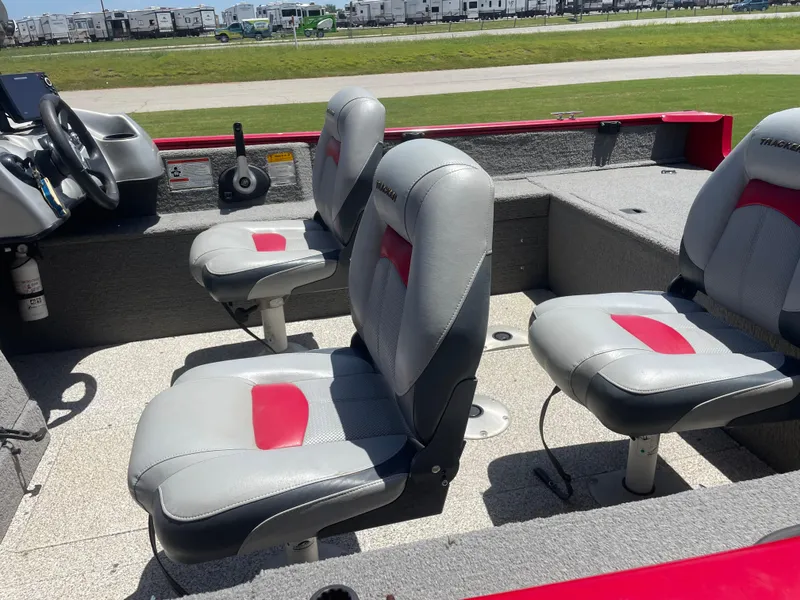 Slide: The Image of 2012 Tracker Pro Guide 175 boat interior with gray and red seating. - 5