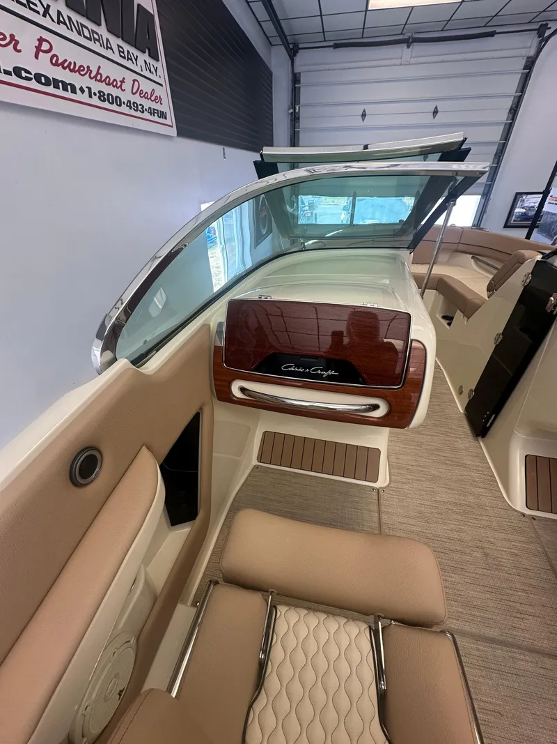 Slide: The Image of 2024 Chris-Craft Launch 25 GT interior with elegant seating and dashboard design. - 10