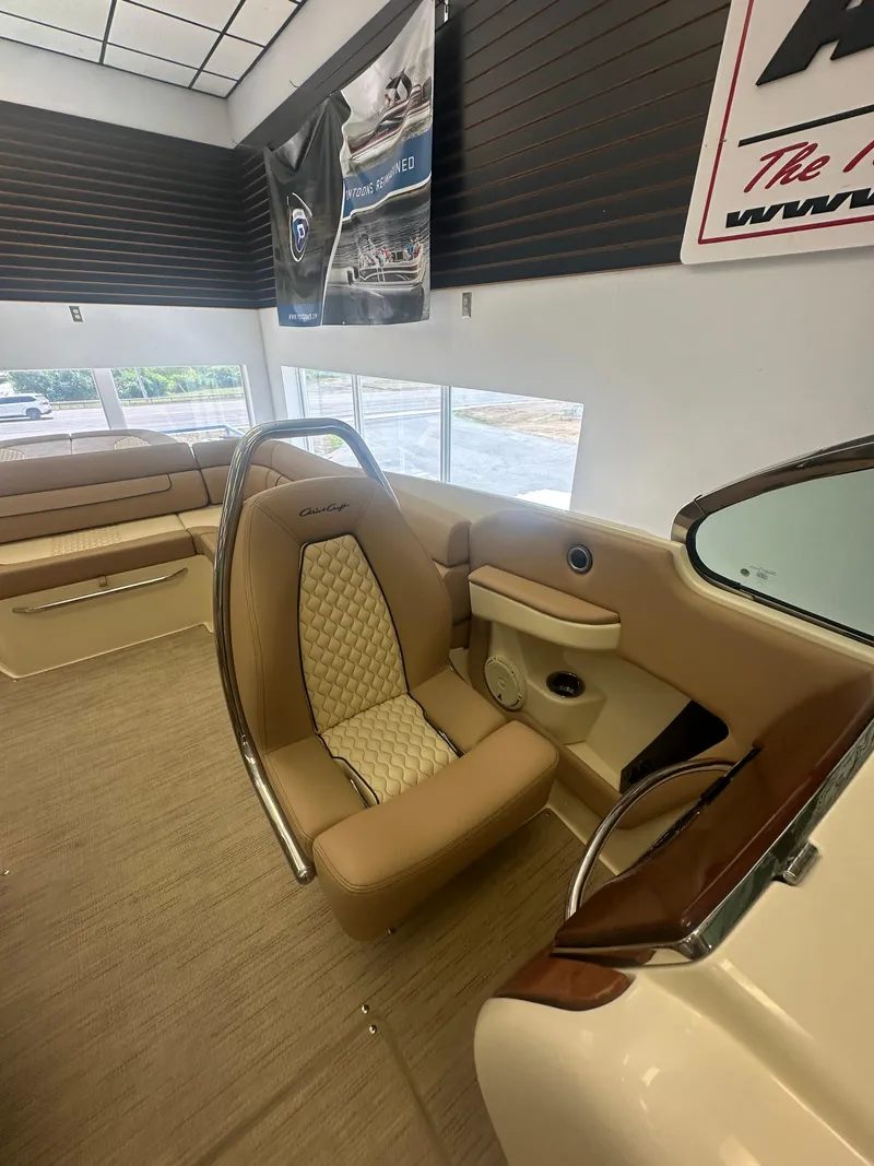 Slide: The Image of 2024 Chris-Craft Launch 25 GT interior with tan leather seating and elegant design. - 14