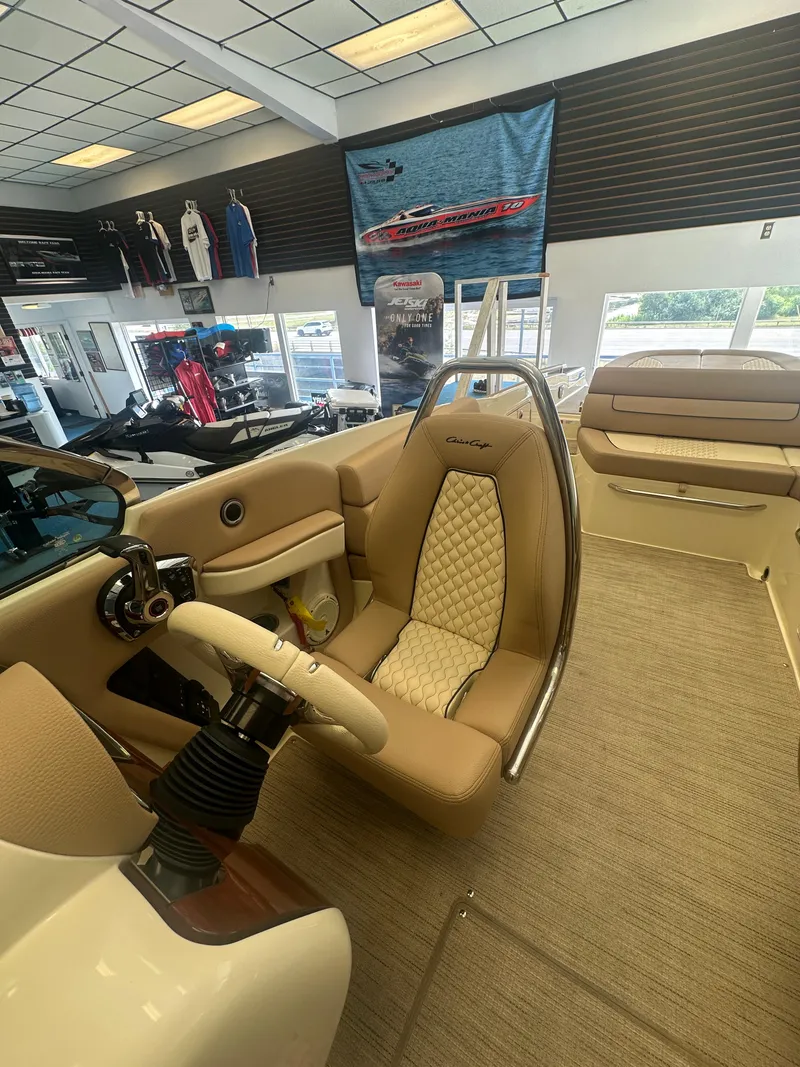 Slide: The Image of 2024 Chris-Craft Launch 25 GT interior showcasing luxurious seating and steering wheel. - 15