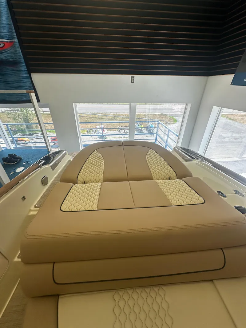 Slide: The Image of 2024 Chris-Craft Launch 25 GT boat interior with luxurious beige seating. - 18