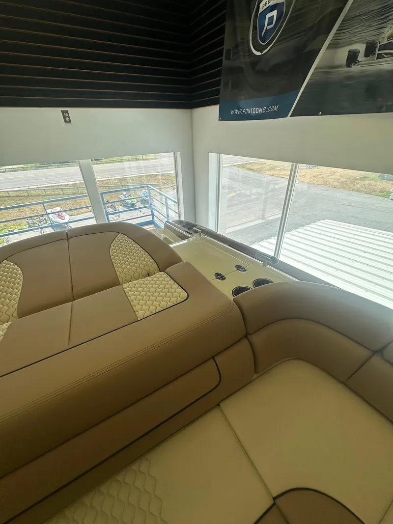 Slide: The Image of 2024 Chris-Craft Launch 25 GT interior with luxurious tan seating and modern design. - 19