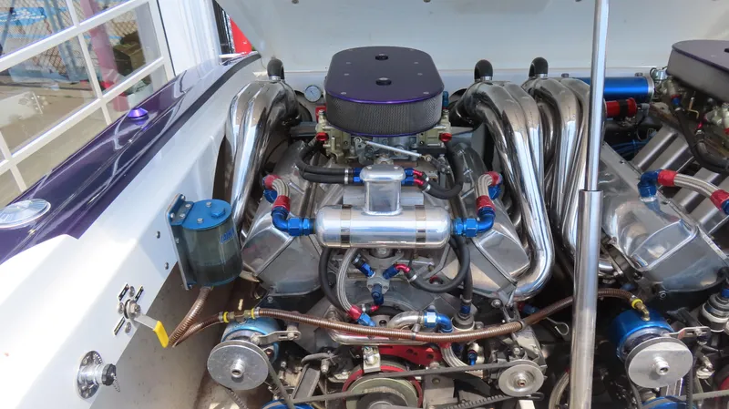 Slide: The Image of Engine of a 1998 Hustler 388 SLINGSHOT with chrome components and detailed wiring. - 15