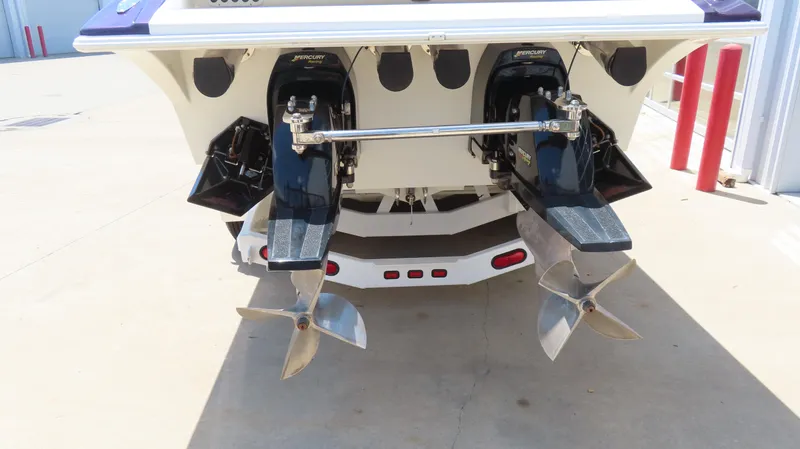 Slide: The Image of Rear view of 1998 Hustler 388 SLINGSHOT boat with dual Mercury outboard engines. - 18