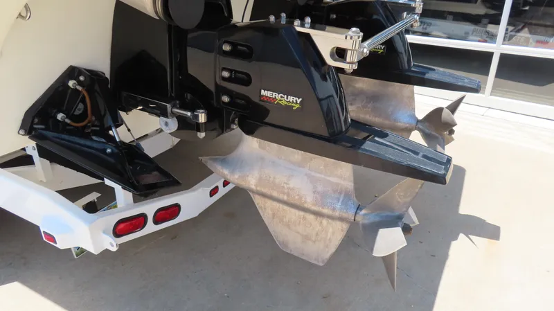 Slide: The Image of Rear view of a 1998 Hustler 388 SLINGSHOT boat with Mercury Racing outboard motors. - 19