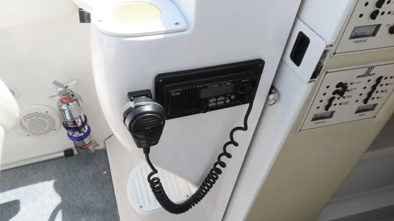 Slide: The Image of Interior of 1998 Hustler 388 SLINGSHOT with radio, fire extinguisher, and control panel. - 8