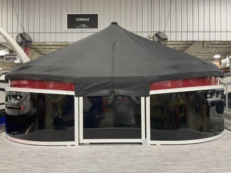 Slide: The Image of 2024 Bennington 24 LXSSB pontoon boat with black cover in a showroom. - 20