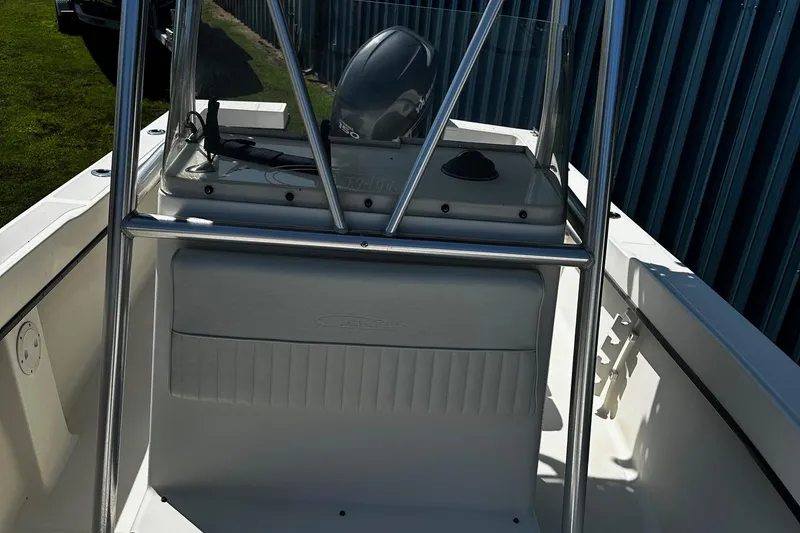 Slide: The Image of 2011 May-Craft 2000CC boat interior with console and seating, featuring stainless steel frame. - 10
