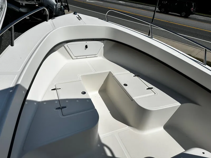 Slide: The Image of 2011 May-Craft 2000CC boat interior with seating and storage compartments. - 13
