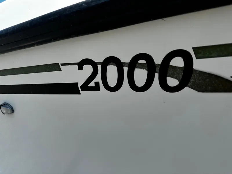 Slide: The Image of Close-up of 2011 May-Craft 2000CC boat model number on hull. - 4