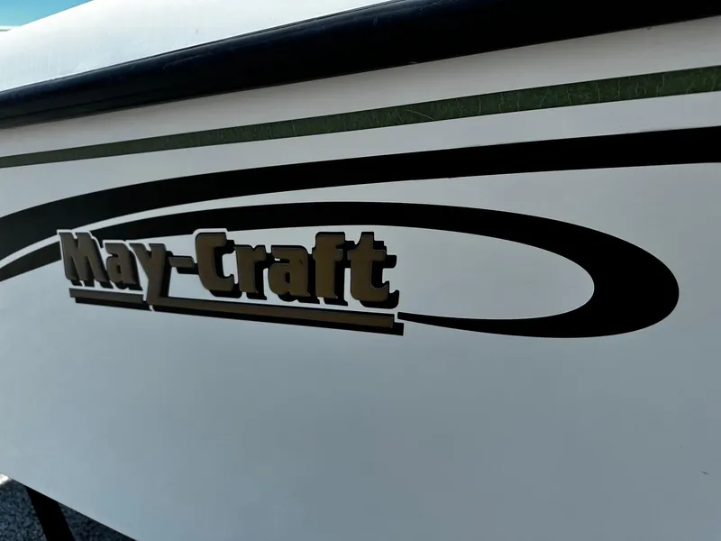 Slide: The Image of Close-up of 2011 May-Craft 2000CC boat logo on white hull. - 5