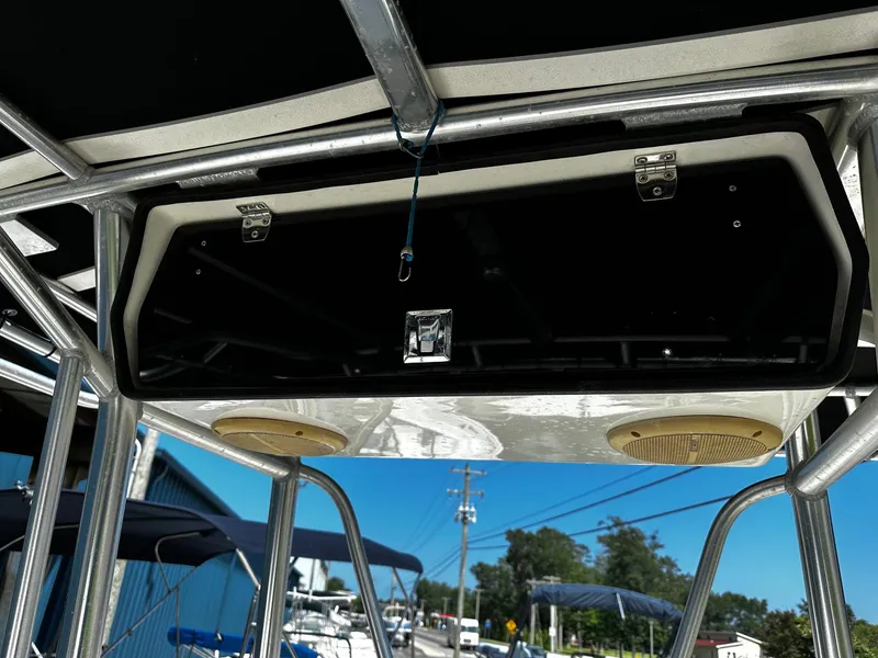 Slide: The Image of 2011 May-Craft 2000CC boat T-top with speakers and storage compartment. - 8