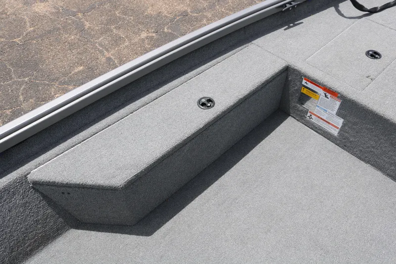 Slide: The Image of 2019 Alumacraft Prowler 175 boat interior with gray carpeted flooring. - 10