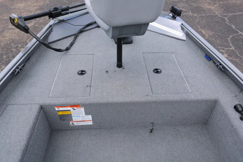 Slide: The Image of 2019 Alumacraft Prowler 175 boat interior with gray carpet and seating. - 12