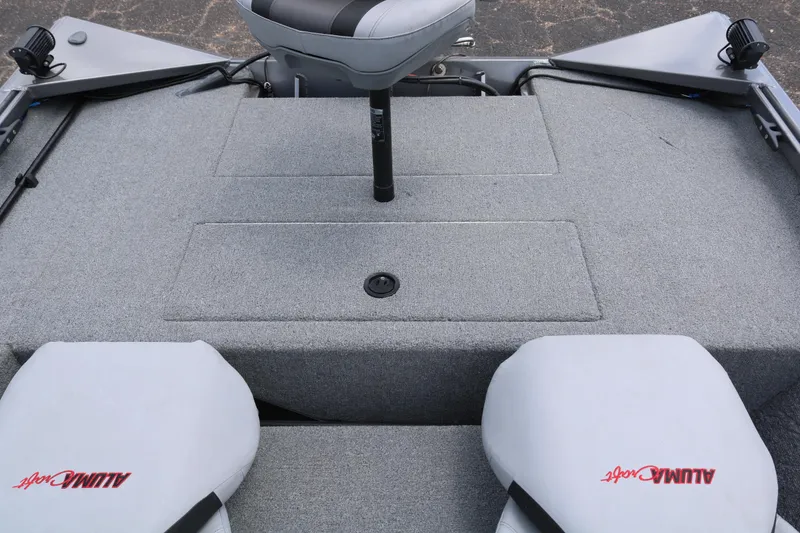 Slide: The Image of 2019 Alumacraft Prowler 175 boat interior with gray carpet and seating. - 18