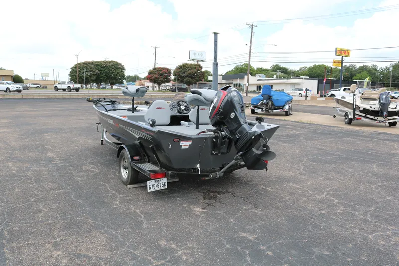 Slide: The Image of 2019 Alumacraft Prowler 175 boat on trailer in parking lot. - 5