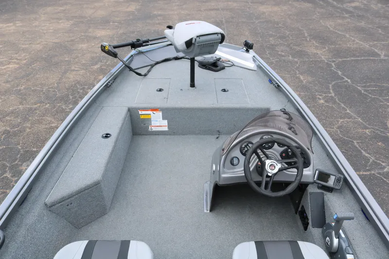 Slide: The Image of 2019 Alumacraft Prowler 175 boat interior with steering console and seating. - 7