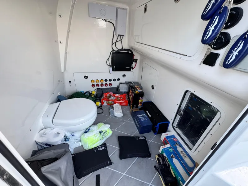 Slide: The Image of Interior of 2022 Invincible 40 Catamaran with storage, toilet, and equipment. - 17