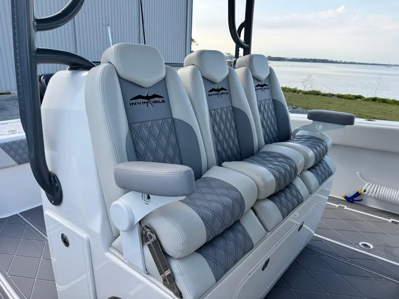 Slide: The Image of Luxurious seating on 2022 Invincible 40 Catamaran, featuring elegant gray and white upholstery. - 22