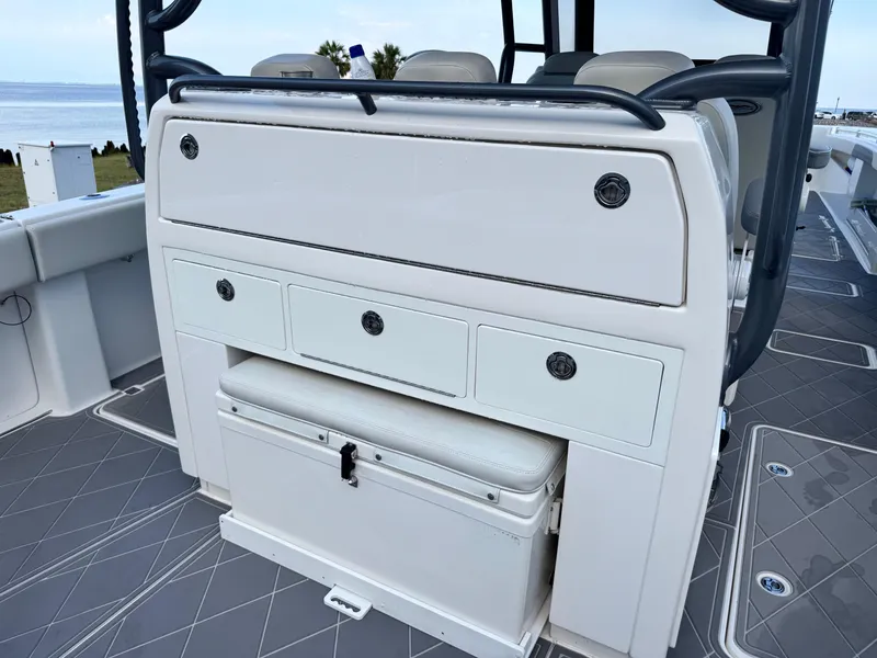 Slide: The Image of 2022 Invincible 40 Catamaran interior with storage drawers and cushioned seating. - 24