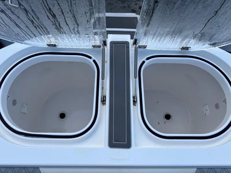 Slide: The Image of Open storage compartments on a 2022 Invincible 40 Catamaran boat. - 31