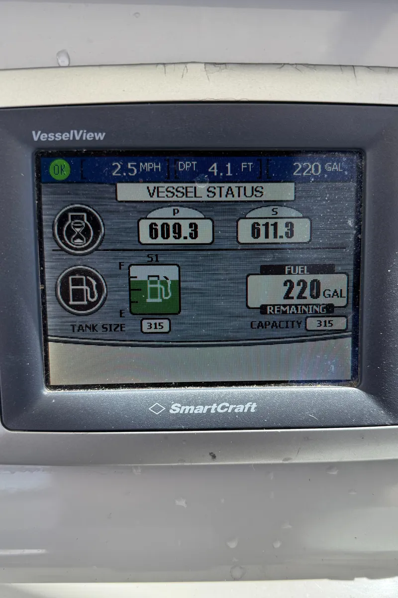 Slide: The Image of Display screen of 2013 Boston Whaler 315 Conquest showing vessel status and fuel levels. - 5
