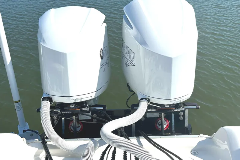 Slide: The Image of Twin Yamaha outboard engines on a 2021 Tidewater 2700 Carolina Bay boat. - 16