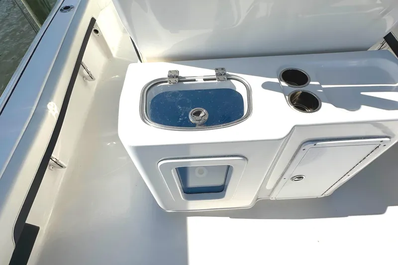 Slide: The Image of 2021 Tidewater 2700 Carolina Bay boat interior with livewell and storage compartments. - 5