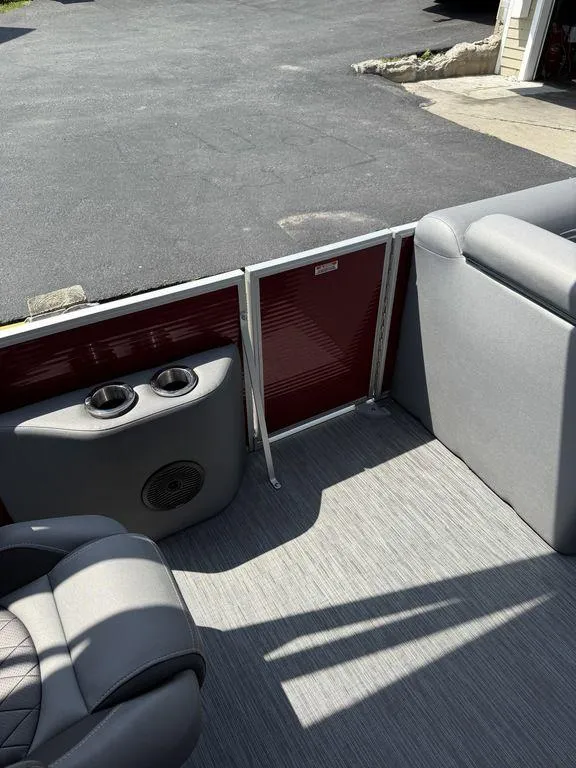 Slide: The Image of Interior of 2022 Bennington 23 LSBA boat with gray seating and cup holders. - 10