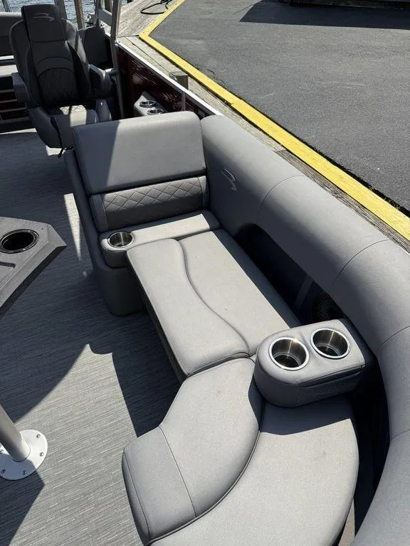 Slide: The Image of Luxurious seating on 2022 Bennington 23 LSBA pontoon boat with cup holders and sleek design. - 11