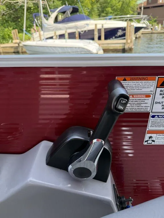 Slide: The Image of Throttle control of a 2022 Bennington 23 LSBA boat, with warning labels visible. - 15