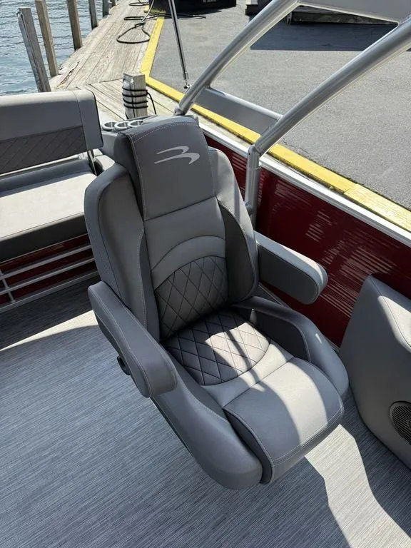 Slide: The Image of Luxury seating on 2022 Bennington 23 LSBA boat, docked by the water. - 16