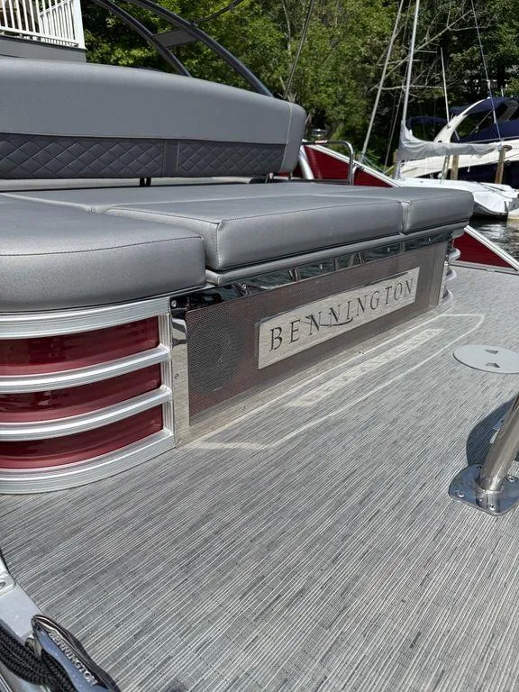 Slide: The Image of 2022 Bennington 23 LSBA pontoon boat with gray seating and stylish design. - 3
