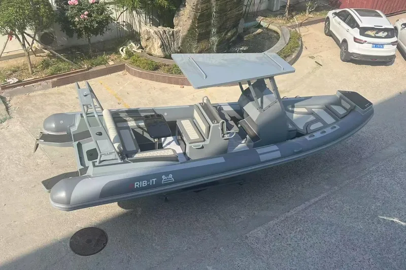 The Image of 2025 RIB-IT Ultra Light 26 inflatable boat parked outdoors, featuring sleek design and modern amenities. - 0