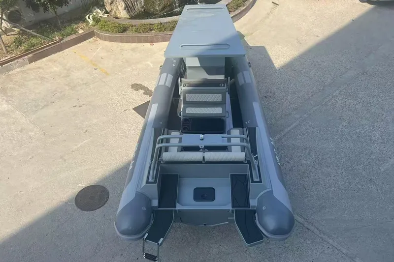 Slide: The Image of 2025 RIB-IT Ultra Light 26 inflatable boat, top view, parked on concrete surface. - 4