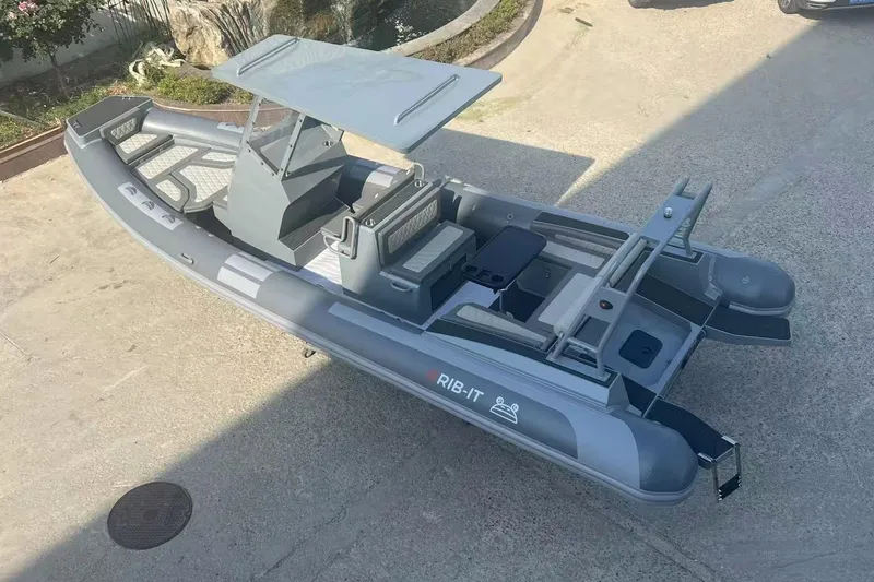 Slide: The Image of 2025 RIB-IT Ultra Light 26 inflatable boat, sleek design, parked on concrete surface. - 5