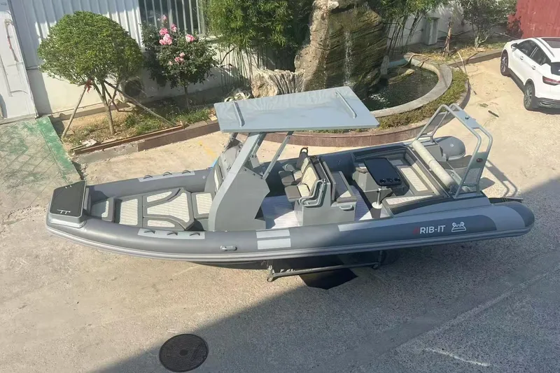 Slide: The Image of RIB-IT Ultra Light 26 boat, 2025 model, parked outdoors in a sunny setting. - 6