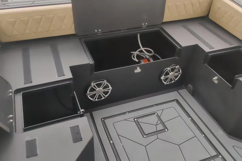 Slide: The Image of Interior of 2025 RIB-IT Ultra Light 26 boat with storage compartments and speakers. - 8
