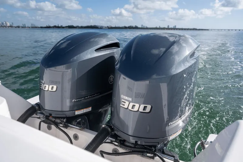 Slide: The Image of Twin Yamaha 300 outboard engines on a 2015 Intrepid 327 CC INFUSED boat. - 13