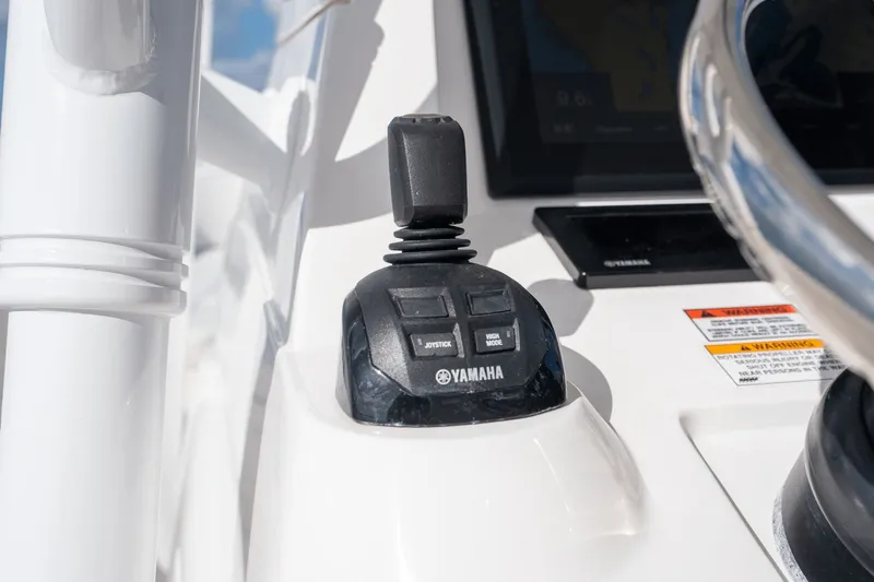Slide: The Image of Close-up of Yamaha joystick control on 2015 Intrepid 327 CC INFUSED boat. - 15