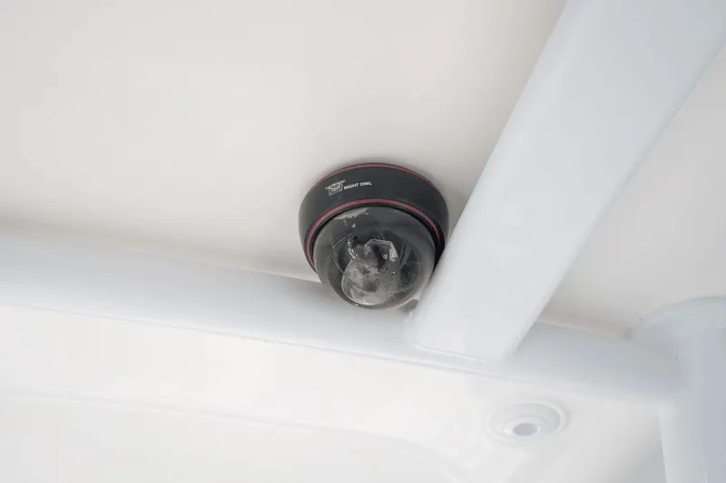 Slide: The Image of Security camera installed on a 2015 Intrepid 327 CC INFUSED boat ceiling. - 19